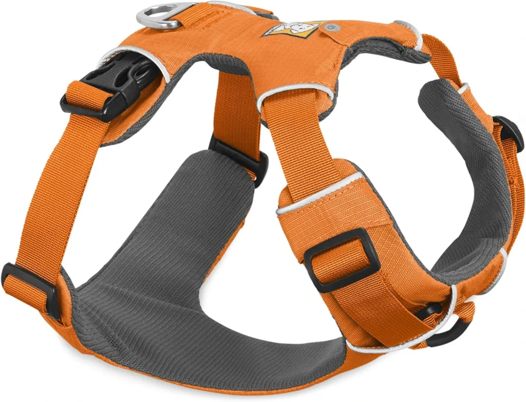 Ruffwear Front Range Harness in orange, with padded chest and back panels, multiple adjustment points, and front and back leash attachment clips, optimized for puppy training.