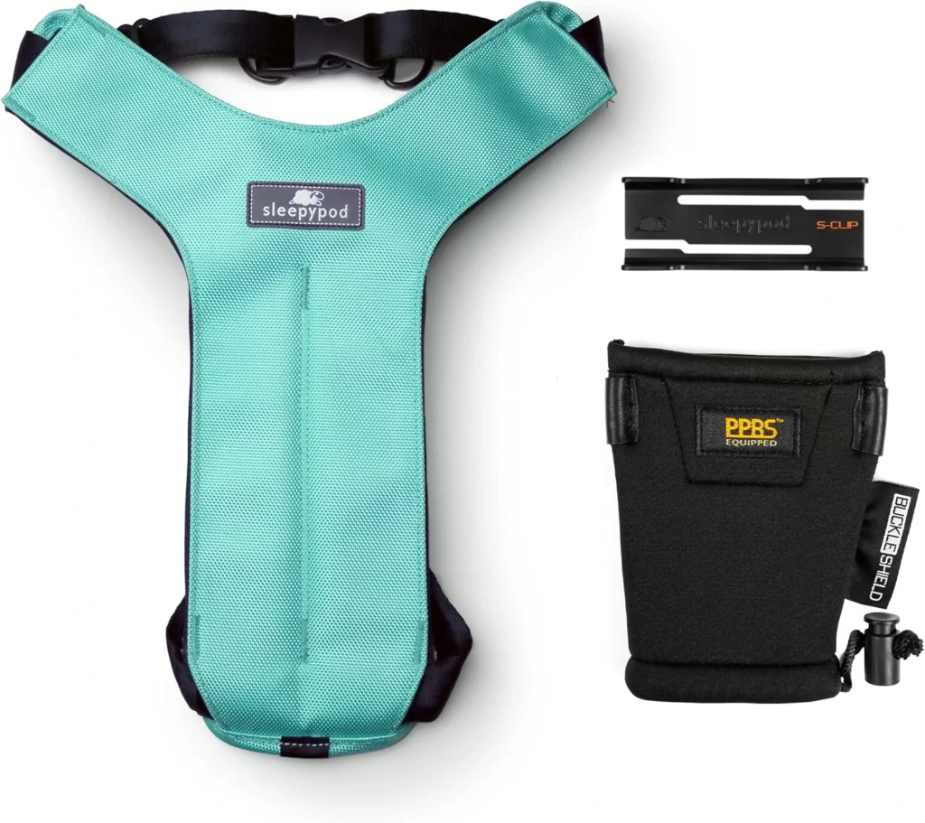 Teal Sleepypod Clickit Sport Plus padded dog car harness with S-Clip and Buckle Shield accessories.